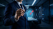 © Graphicsworld - Goal setting and strategic focus using digital interface. businessman selecting target icon and strategy dashboard. strategic planning, performance tracking and digital business management for success