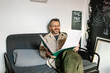 © Anna Artemenko/Stocksy - portrait of a designer working in his office