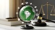 © Sangida - Globe and gavel on a desk with books and scales