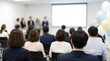 © CuteBee - An attentive audience watches a presentation on a blank screen in a conference room, with festive balloons adding a celebratory touch to the event.