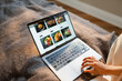 © DZ FILM/Stocksy - A woman makes an online food order on a laptop