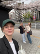 © Asya Molochkova/Stocksy - Springtime Fun Under Sakura Blossoms in Urban Japan