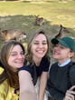 © Asya Molochkova/Stocksy - Cheerful travelers with deers in sunny day