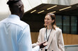 © Artem Podrez/Stocksy - Professional Discussion in Modern Office Hall