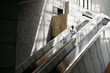 © Artem Podrez/Stocksy - Man Ascending with Drink and Phone in Modern Space