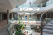 © Luis Velasco/Stocksy - People In Modern Office Atrium