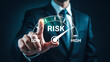 © Ruhanul - Risk meter gauge showing high risk level with businessman pointing finger on display, representing financial risk assessment and management in business decision making