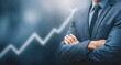 © dmmarychev - Businessman in suit with arms crossed standing in front of growing finance chart