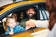 © djile - Happy family shaking hands with car dealer after purchase