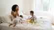 © Yash - Authentic Motherhood Lifestyle Background with Messy Bed and Toddlers