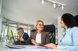 © Nenad - A group of business people partners during a set team meeting in the modern office.