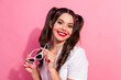 © deagreez - Young woman smiles with white sunglass in pink background wearing casual fashion