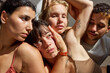 © Javier Díez/Stocksy - Group of friends posing creatively in warm, natural light