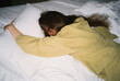 © Asya Molochkova/Stocksy - Dreamy woman sleeping on bed