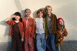 © Irina Ozhigova/Stocksy - Group of children dressed in colorful costumes posing outdoors