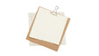 © Mamer - Minimalist composition featuring a layered stack of paper scraps held together by a binder clip on a clean white background