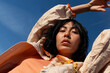 © María Soledad Kubat/Stocksy - Female model outdoors with textured fashion outfit