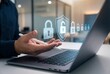 © Meow Creations - Person using stylus on laptop with digital security icons