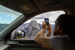 © Raymond Forbes LLC/Stocksy - Road trip Photo with Cell phone
