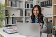 © kamiphotos - Professional businesswoman reviewing performance reports in a modern office, analyzing results and planning next steps to improve strategy, productivity, and company growth.