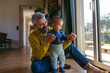 © Halfpoint - Father with little toddler son at home.