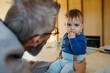 © Halfpoint - Father with little toddler son at home.