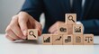 © su - Financial statement analysis and showing cubes arranged to reveal key business insights using wooden cubes, symbolic icons, human hand, natural depth of field, soft blurred background, minimal desk ba