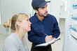 © auremar - woman with engineer inspecting electric counter equipment