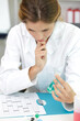 © auremar - girl is checking the result of experiment