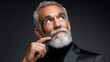 © piai - Distinguished Older Man Stroking Beard in Deep Contemplation