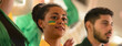 © Halfpoint - Brazilian young football fans celebrating their team's victory at stadium.