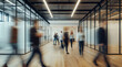 © jex - Blurry group moves in office corridor, conference room with glass wall shows business meeting, energetic teamwork environment.