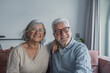 © Daniel - Happy laughing older married couple talking, laughing, standing in home interior together, hugging with love, enjoying close relationships, trust, support, care, feeling joy, tenderness