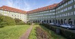 © Mara Brandl/imageBROKER - Inner courtyard with park and green residential buildings, Borstei, heritage-protected residential estate, Moosach district, Munich, Bavaria, Germany