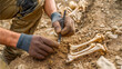 © Konstantin divelook - Archaeologists uncover ancient bones while excavating a historical site in the wilderness, revealing secrets of the past in the golden afternoon light