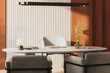 © Oleksandr Shcherban/Stocksy - modern office interior with warm terracotta walls and soft sunlight