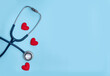 © Beatriz - Preventive Healthcare and Health Insurance Concept with Three Red Hearts and Partially Visible Stethoscope on Blue Background Horizontal Web Banner for Medical Services and Patient Protection