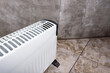 © Natallia - Modern portable electric heater, heating the basement. Drying the walls of a damp room.
