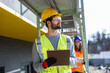 © Mediteraneo - Male and female engineers performing a safety inspection on construction scaffolding.