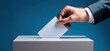© Lady O - Hand of a businessman putting a paper ballot into a rectangular box during voting or elections.