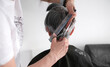 © Ievgen Skrypko - Hairdresser Trimming Elderly Woman'S Gray Hair At Home