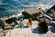 © Cara Dolan/Stocksy - Family with dog on the coast of Maine
