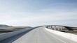 © Muhammad - A winding road stretches through a vast desert landscape under a blue sky with a bridge in the distance.