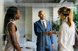 © BONNINSTUDIO/Stocksy - Business professionals shaking hands forming new agreement