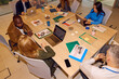 © Boris Jovanovic/Stocksy - Colleagues work together in a shared office space