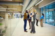 © Boris Jovanovic/Stocksy - Corporate workers talk to each other