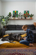 © Danil Nevsky/Stocksy - Woman caring for old disabled dog indoors