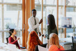 © VICTOR TORRES/Stocksy - Diverse group collaborating in modern office