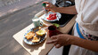 © Raul Navarro/Stocksy - Woman preparing healthy breakfast inside camper van