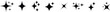 © Design_a2z - A horizontal array of various black four pointed sparkle shapes and shining star icons on white